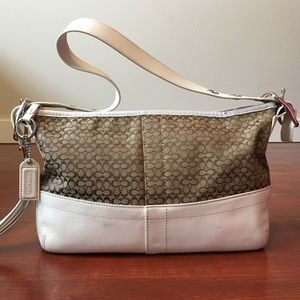 Coach khaki mini signature canvas EW duffel bag.